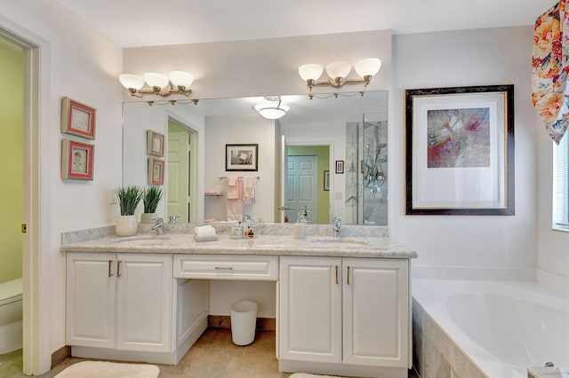 full bathroom with vanity, toilet, and separate shower and tub