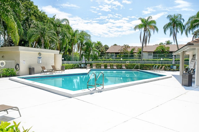 view of swimming pool featuring a patio