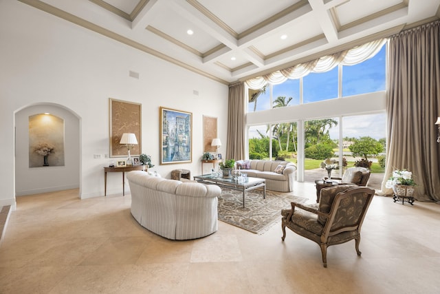 living room with beam ceiling, coffered ceiling, a high ceiling, and crown molding