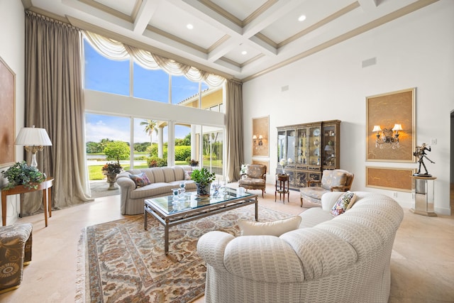 living room with beam ceiling, coffered ceiling, a towering ceiling, and crown molding