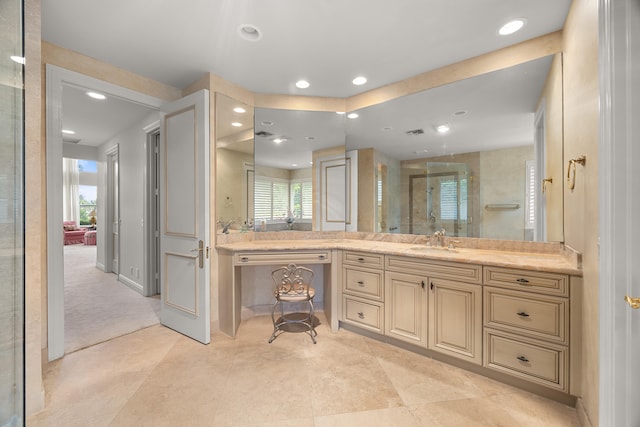 bathroom with vanity and an enclosed shower