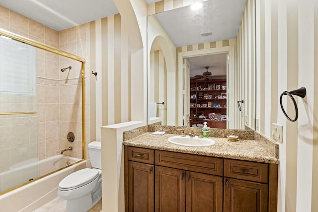 full bathroom with vanity, combined bath / shower with glass door, toilet, and tile patterned floors