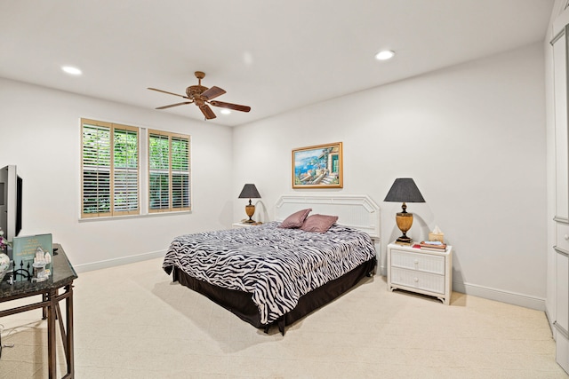 bedroom with light carpet and ceiling fan