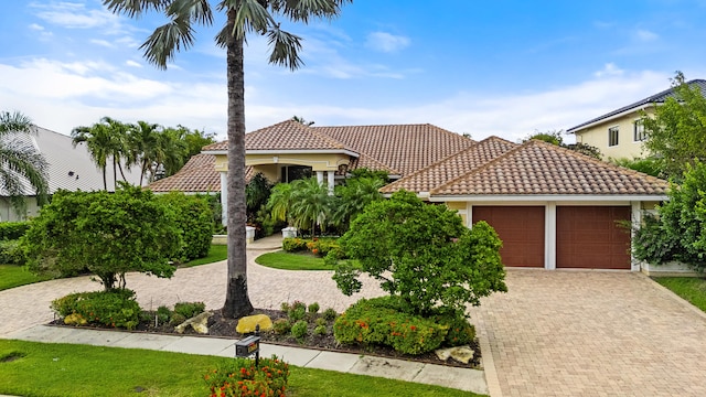 mediterranean / spanish-style home featuring a garage