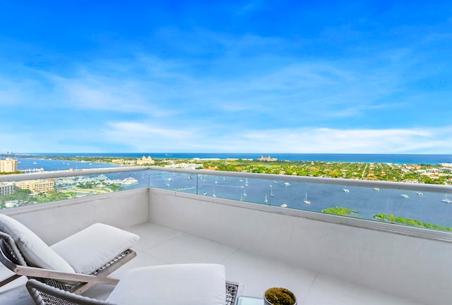 balcony featuring a water view