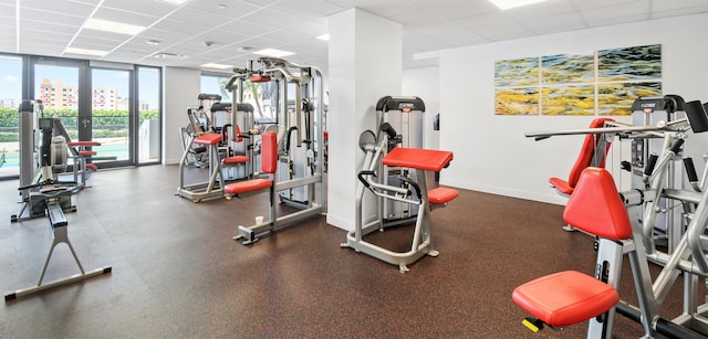 gym featuring a paneled ceiling