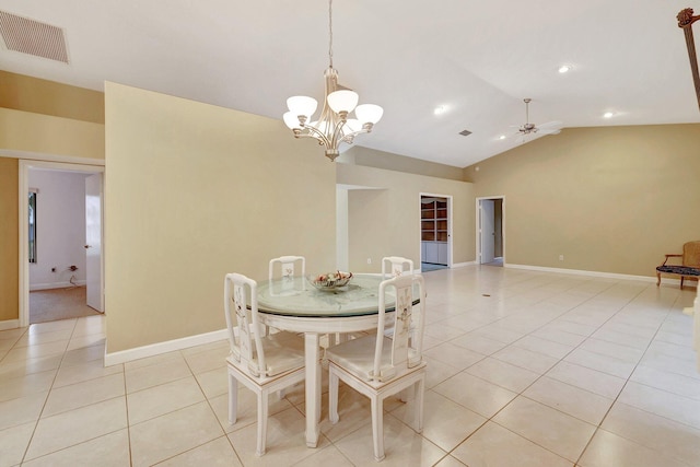 tiled dining space with ceiling fan with notable chandelier and vaulted ceiling