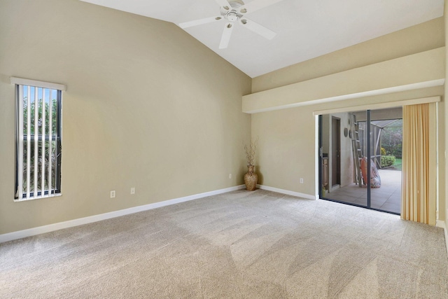 spare room with vaulted ceiling, carpet flooring, and ceiling fan