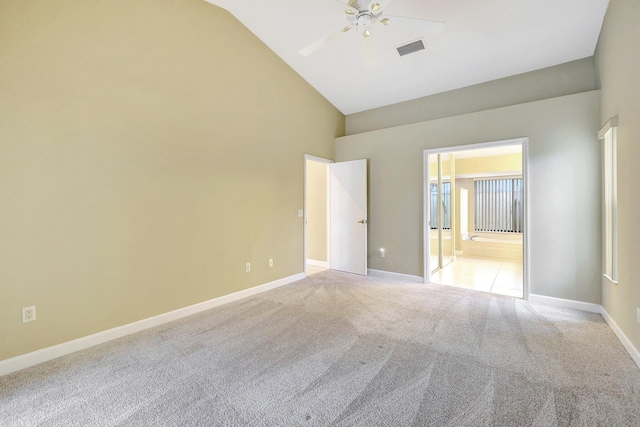 unfurnished room with high vaulted ceiling, light carpet, and ceiling fan