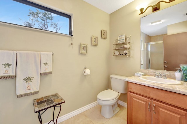 bathroom with vanity, tile patterned floors, a shower with door, and toilet