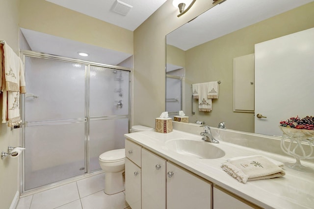 bathroom featuring vanity, toilet, an enclosed shower, and tile patterned flooring