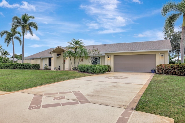 single story home featuring a garage and a front yard