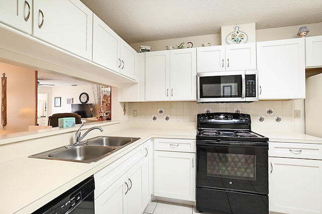 kitchen featuring white cabinetry, sink, backsplash, black appliances, and a textured ceiling