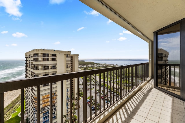 balcony featuring a water view