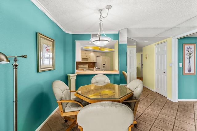 dining space with crown molding and tile patterned flooring