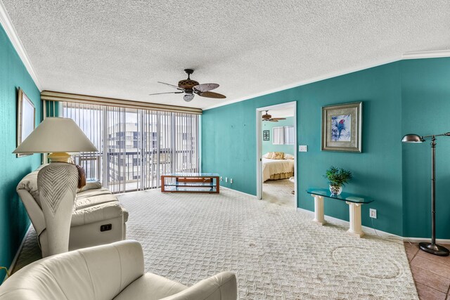 9500 S Ocean Dr Unit 1909, Jensen Beach, FL 34957 - living room with crown molding, a ceiling fan, baseboards, and a textured ceiling