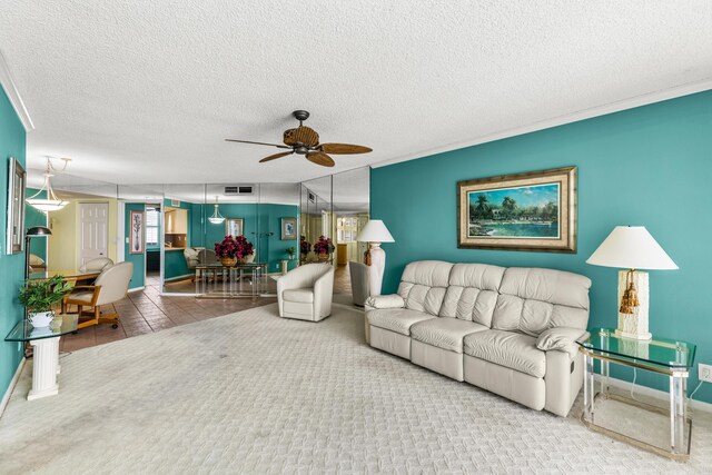 9500 S Ocean Dr Unit 1909, Jensen Beach, FL 34957 - living room with a ceiling fan, a textured ceiling, baseboards, and tile patterned floors