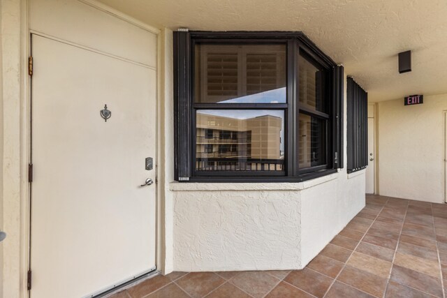 9500 S Ocean Dr Unit 1909, Jensen Beach, FL 34957 - view of exterior entry featuring stucco siding