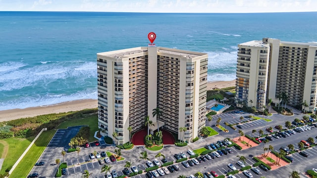 aerial view with a water view and a view of the beach