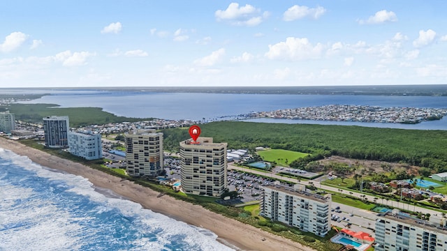 bird's eye view featuring a water view and a view of the beach