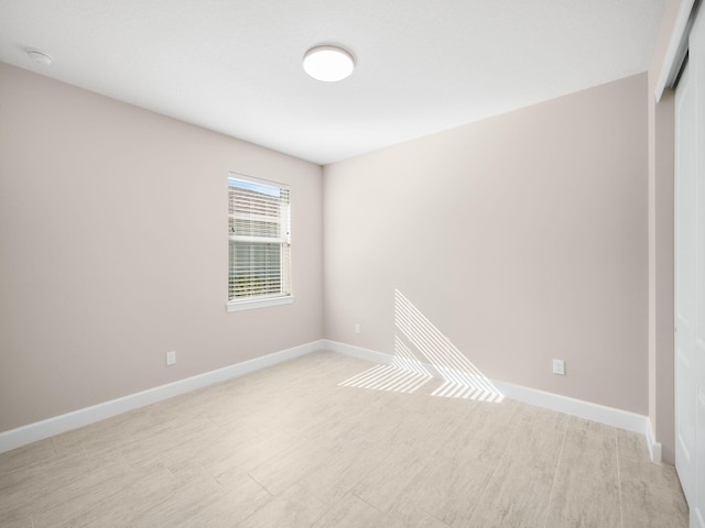 unfurnished room with light hardwood / wood-style floors