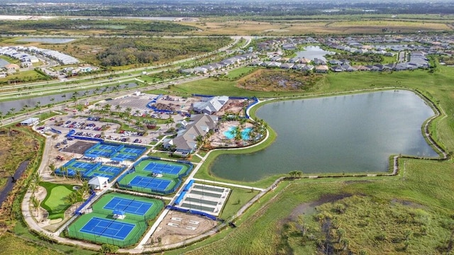 birds eye view of property with a water view