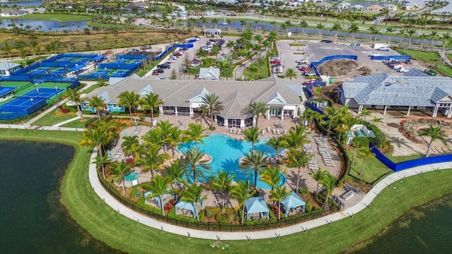 birds eye view of property with a water view