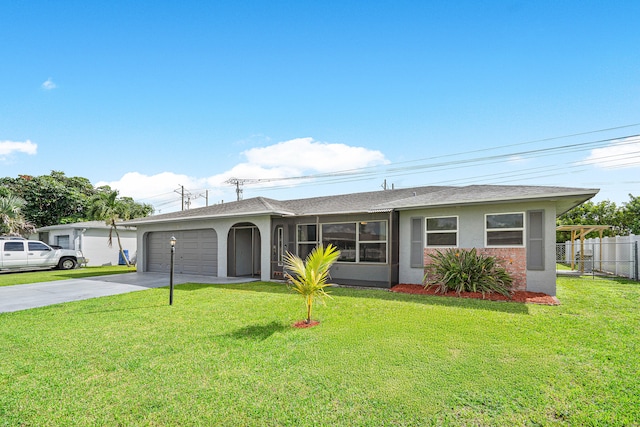 single story home with a garage and a front lawn