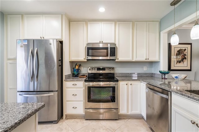 kitchen with white cabinetry, light stone countertops, and appliances with stainless steel finishes