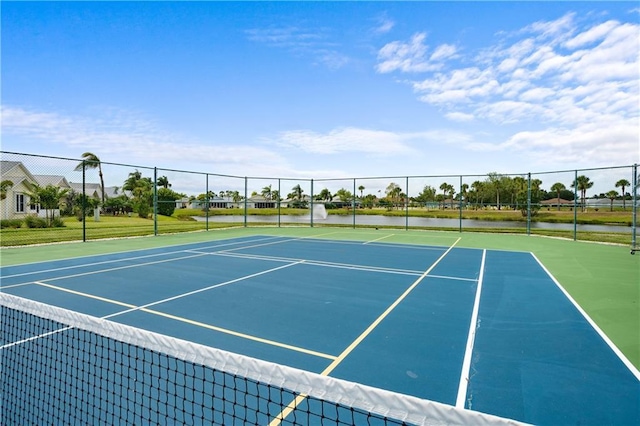 view of sport court with a water view