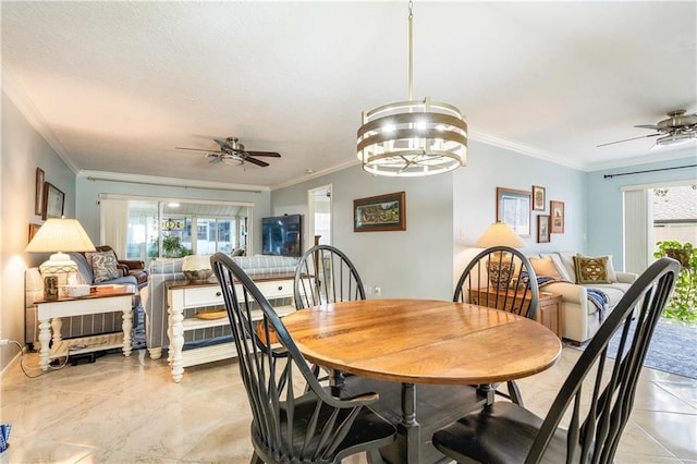 dining room with crown molding, plenty of natural light, and ceiling fan with notable chandelier