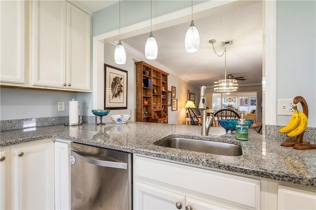 kitchen with dishwasher, decorative light fixtures, white cabinets, dark stone countertops, and ornamental molding