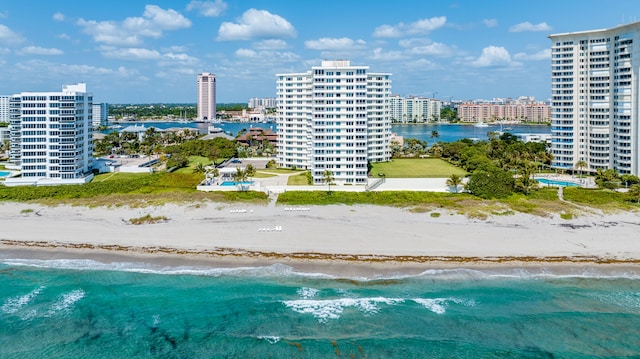 bird's eye view featuring a water view and a view of the beach