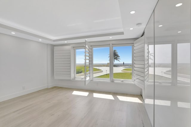 600 S Ocean Blvd Unit 103, Boca Raton, FL 33432 - spare room with light wood finished floors, recessed lighting, and a raised ceiling