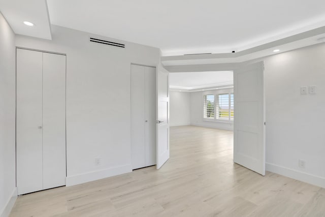 spare room featuring light wood-type flooring