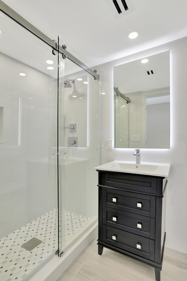 bathroom featuring vanity and walk in shower