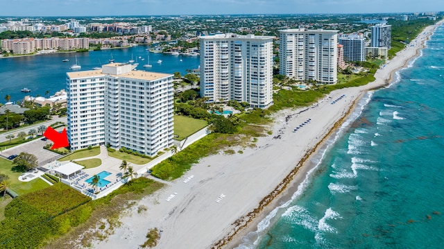 birds eye view of property featuring a view of the beach and a water view