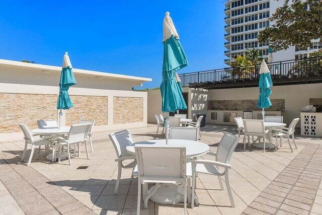 600 S Ocean Blvd Unit 103, Boca Raton, FL 33432 - view of patio / terrace with outdoor dining space