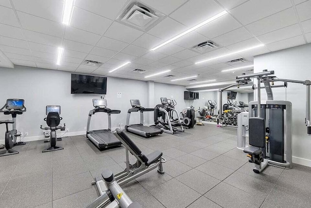 gym featuring a drop ceiling