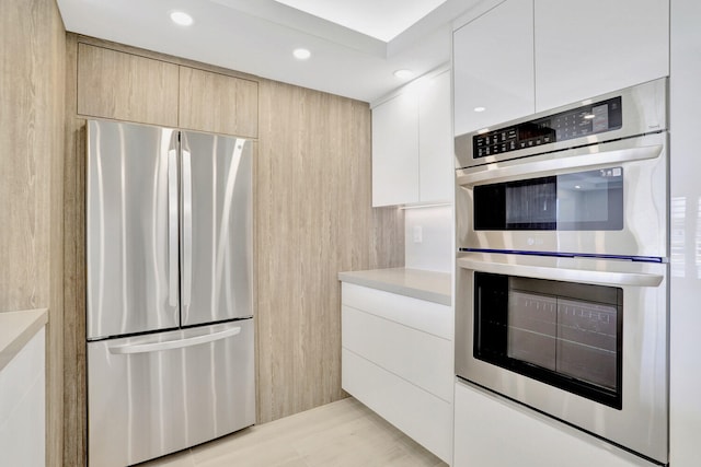 kitchen featuring light brown cabinetry and stainless steel appliances