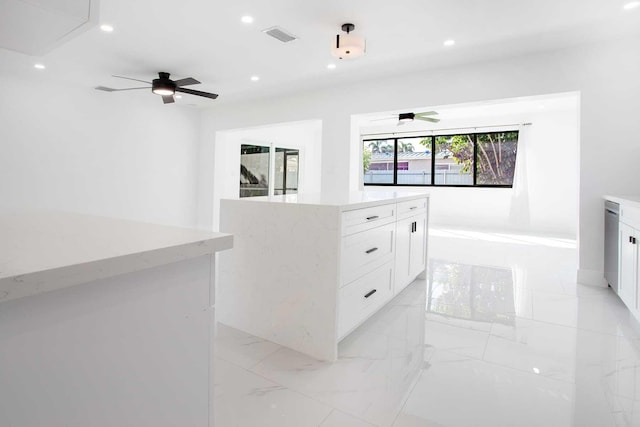 interior space featuring ceiling fan