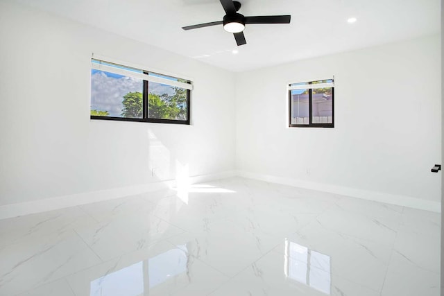 empty room with a healthy amount of sunlight and ceiling fan