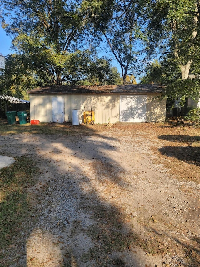 view of property exterior with an outbuilding