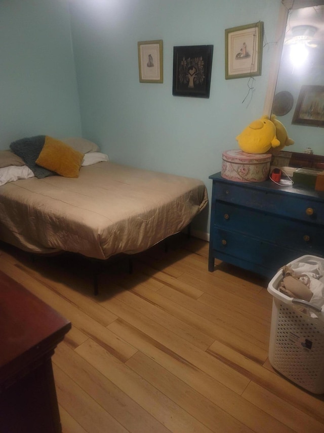 bedroom with light wood-type flooring