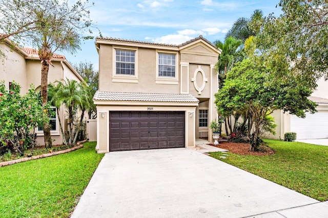 view of front of house with a front yard and a garage