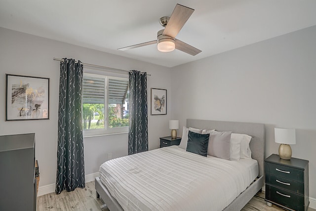 bedroom featuring light hardwood / wood-style floors and ceiling fan