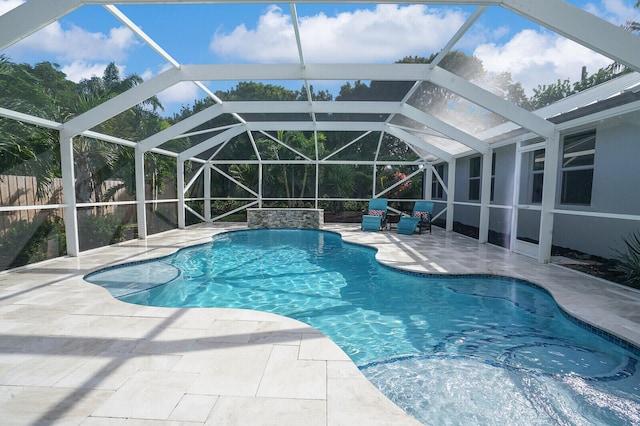 view of pool featuring a lanai and a patio