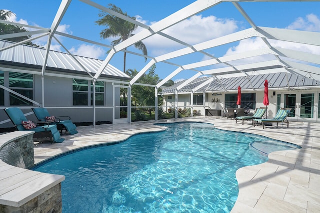 view of swimming pool featuring a patio, outdoor lounge area, and a lanai