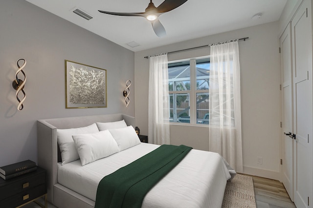 bedroom featuring ceiling fan and light hardwood / wood-style flooring