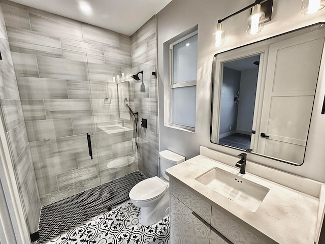 bathroom featuring walk in shower, tile patterned flooring, vanity, and toilet